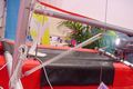 Kicking strap holds boom down when running with wind