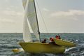 Yellow boat and sail flash.